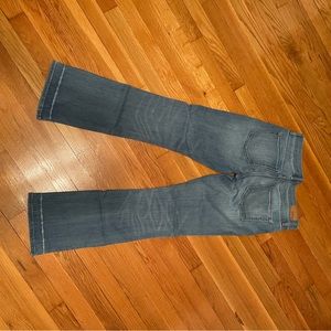 Express barely boot factory lines at bottom hems